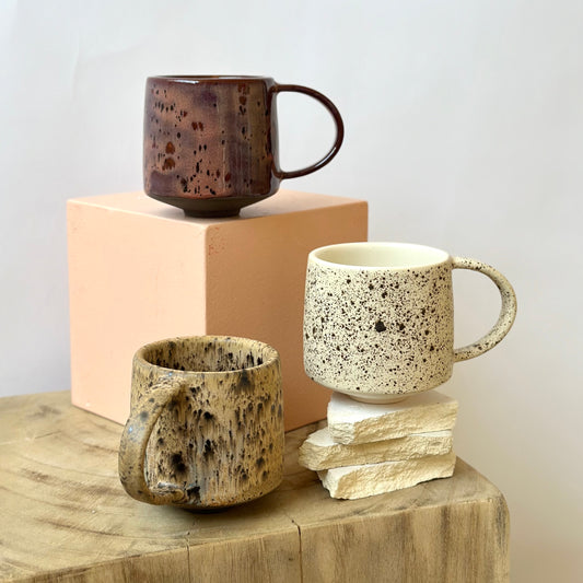 Step back in time with The Era Mug. Inspired by the eclectic and earthy ceramic style of the 1970s, each piece is carefully hand-painted, making every mug unique with subtle variations. The glaze is painted atop a rich, custom brown clay that is exclusive to Pigeon Toe Ceramics.