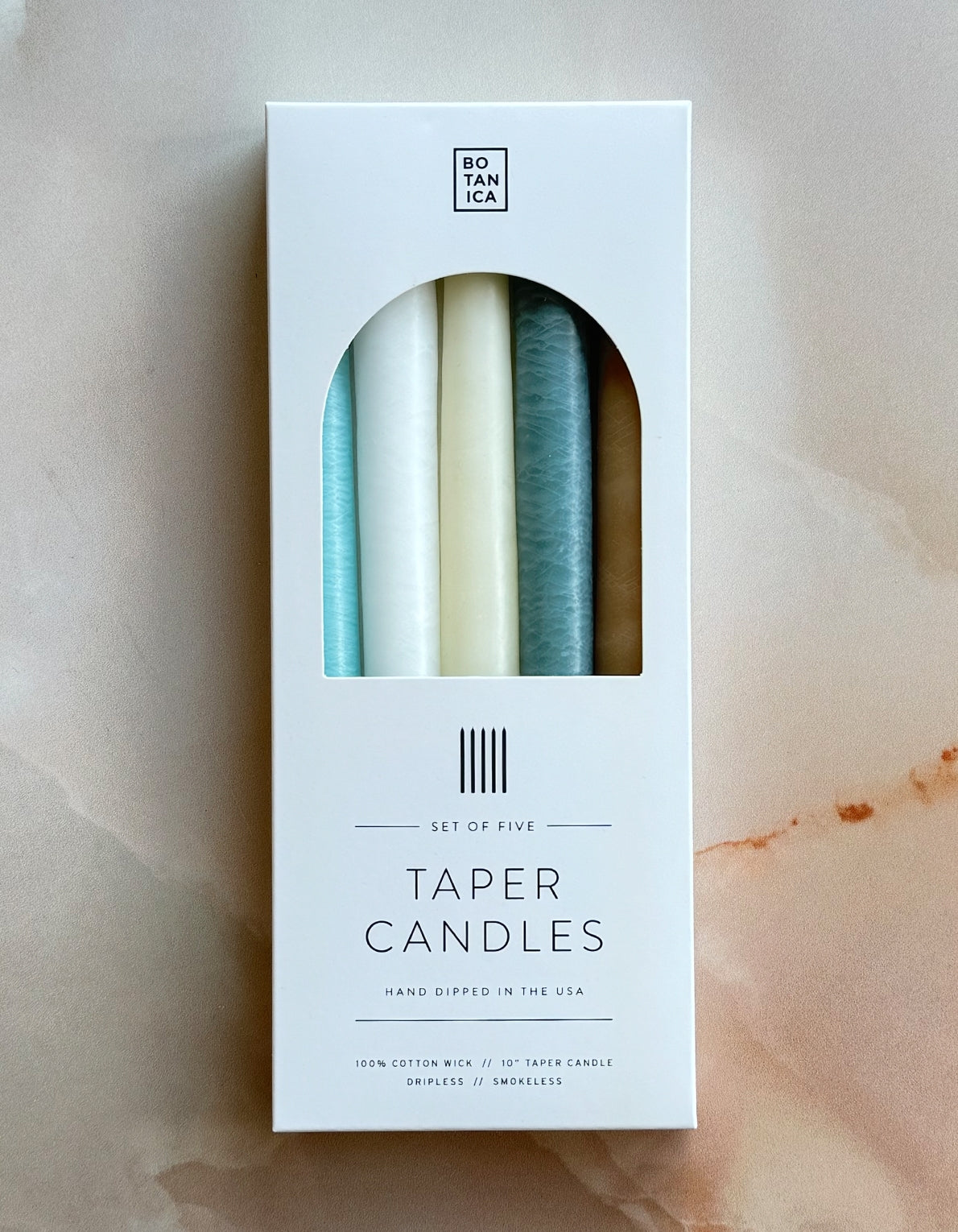 Botanica's set of five tapered candles are dipped over 20 times by hand, creating the ideal taper–dripless and smokeless–perfect for dinner parties and creating warm, homey ambiance. 
