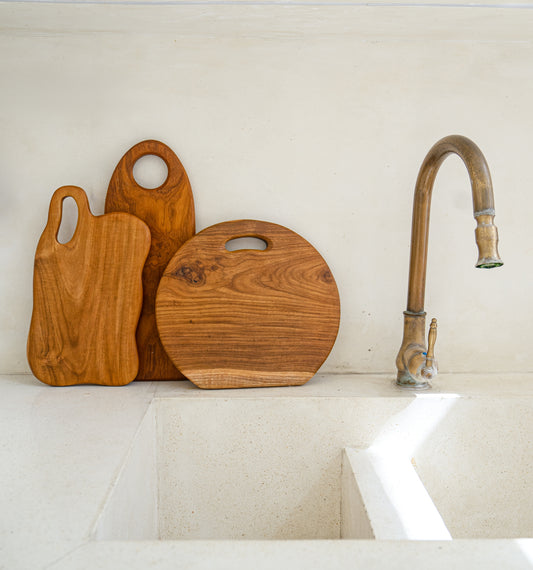 Handcrafted teak wood cutting board for both serving and chopping. Artisans & company