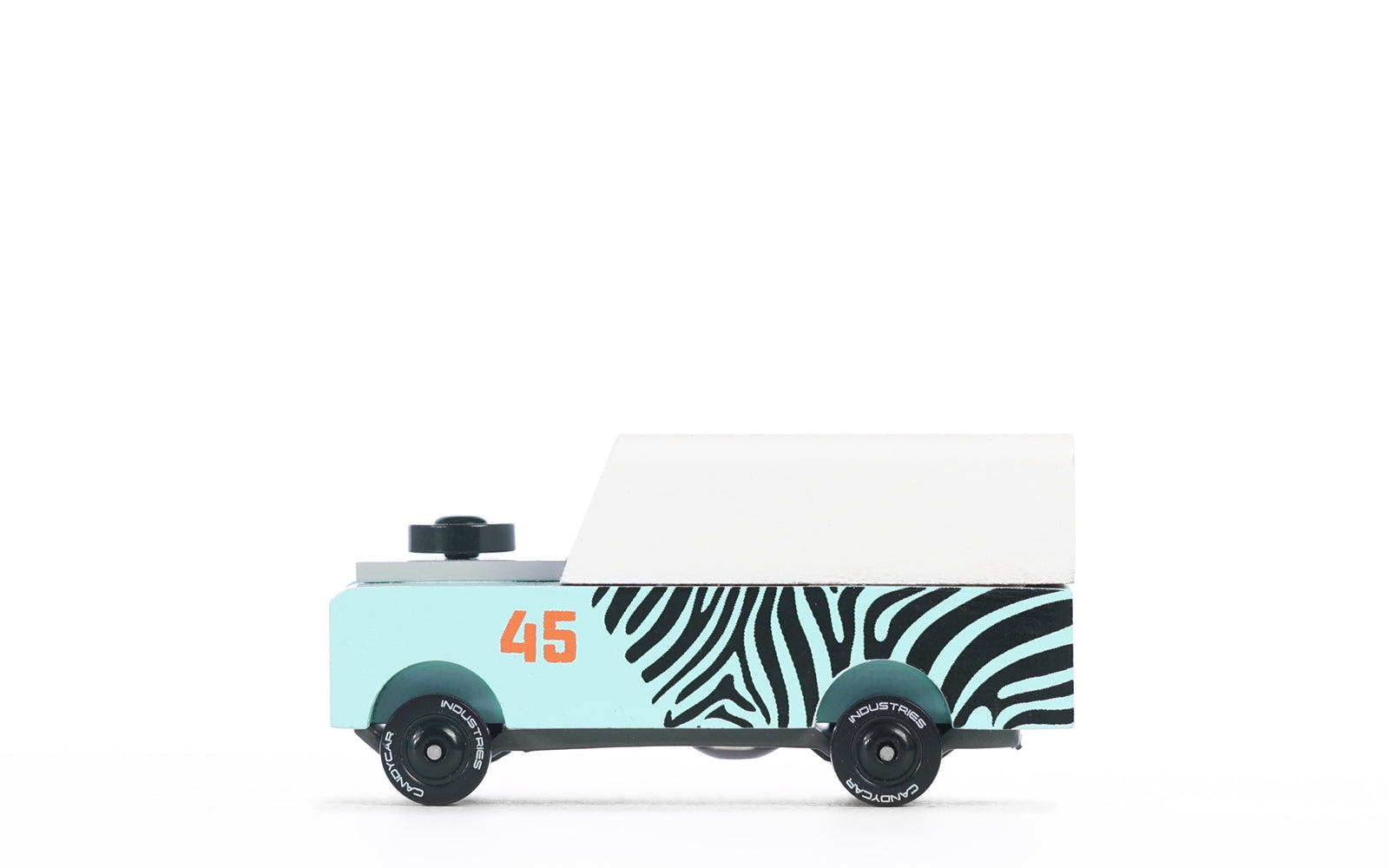 Mini Zebra Drifter toy car by Candylab Toys features solid beech wood and water-based paints. Made sustainably, made to last, made for fun.   Wood, soy inks, water-based paints, degradable rubber, and metal parts are all part of Candylab's old school way of making toys, with a modern design twist.