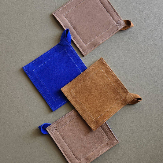Double-sided suede potholder with loop.