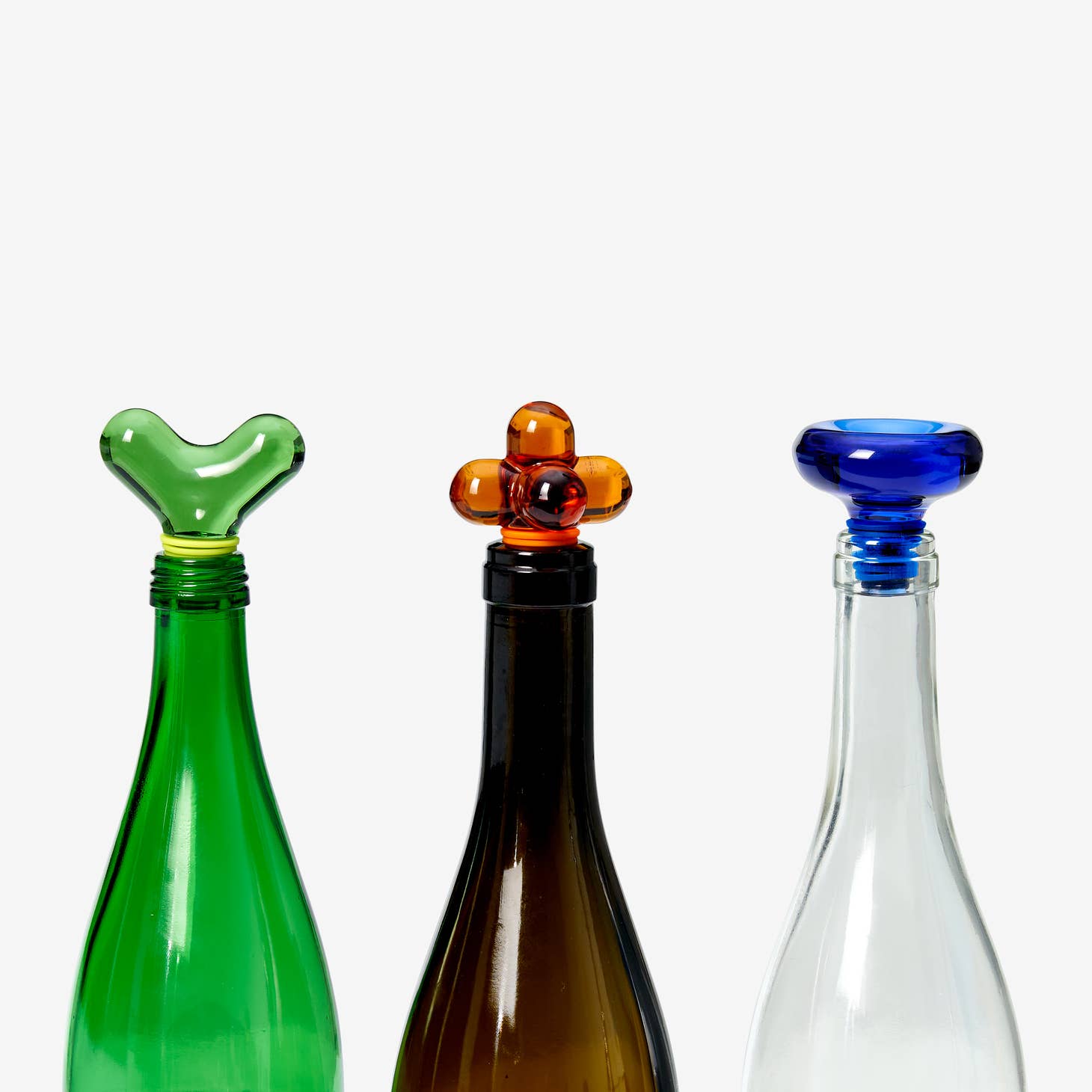 areaware hobknob drink stoppers / Glass bottle stoppers takes their shape from the designer's line of hardware knobs while celebrating the beloved ritual of sharing a drink with friends. Hobknobbing, if you will. Pop it into an open bottle of your favorite beverage to keep it fresh and looking smart.