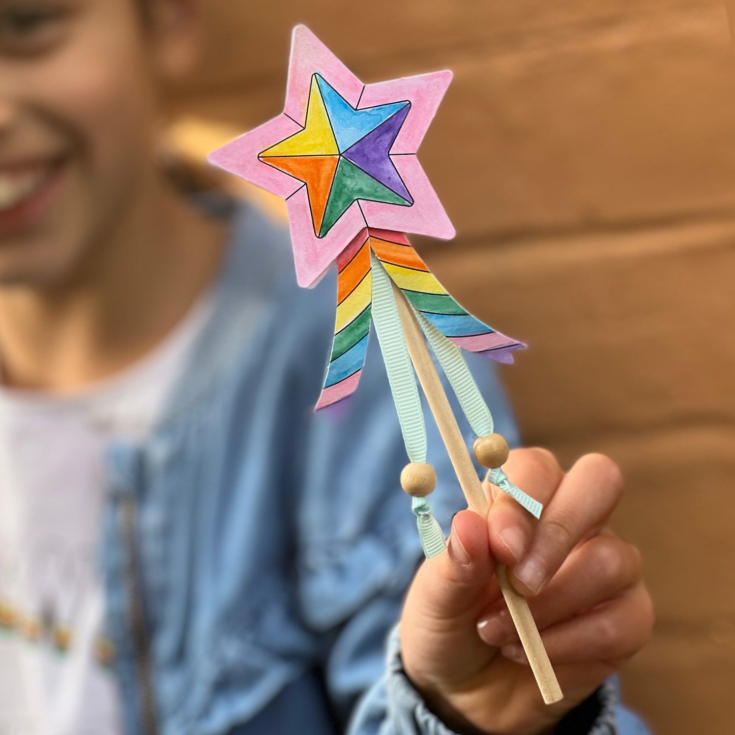Children can colour the star & ribbon cut outs with their chosen pattern, then it's time to construct their wand. Once the stick & ribbons are taped on, the stars can be stuck together. Beads can be added to the base of the ribbons for additional effect. Time to wave those wands & spread the magic. Each kit is plastic free & lovingly assembled by hand.