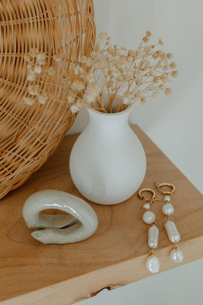 Unique and elegant, these pearl duster earrings were designed with 4 freshwater pearls in various shapes and sizes interconnected with delicate gold fill wire. All Dea Dia pieces are proudly designed and handmade in Downtown Los Angeles.