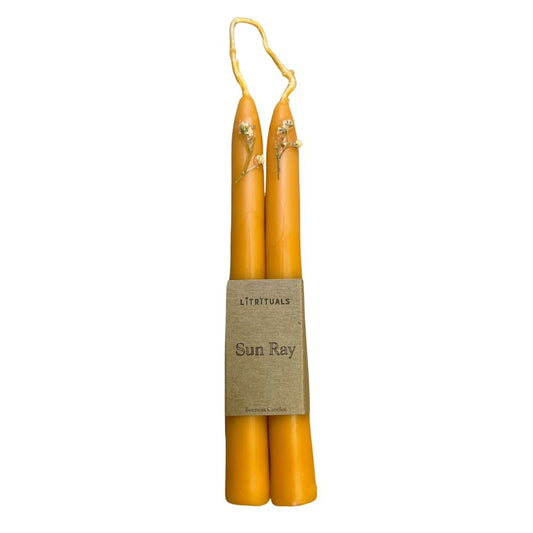 Handcrafted with 100% beeswax and natural dyes, these candles retain their vibrant tangerine hue and exquisite adornments while evoking the sensation of basking in the warm embrace of a summer sun. 