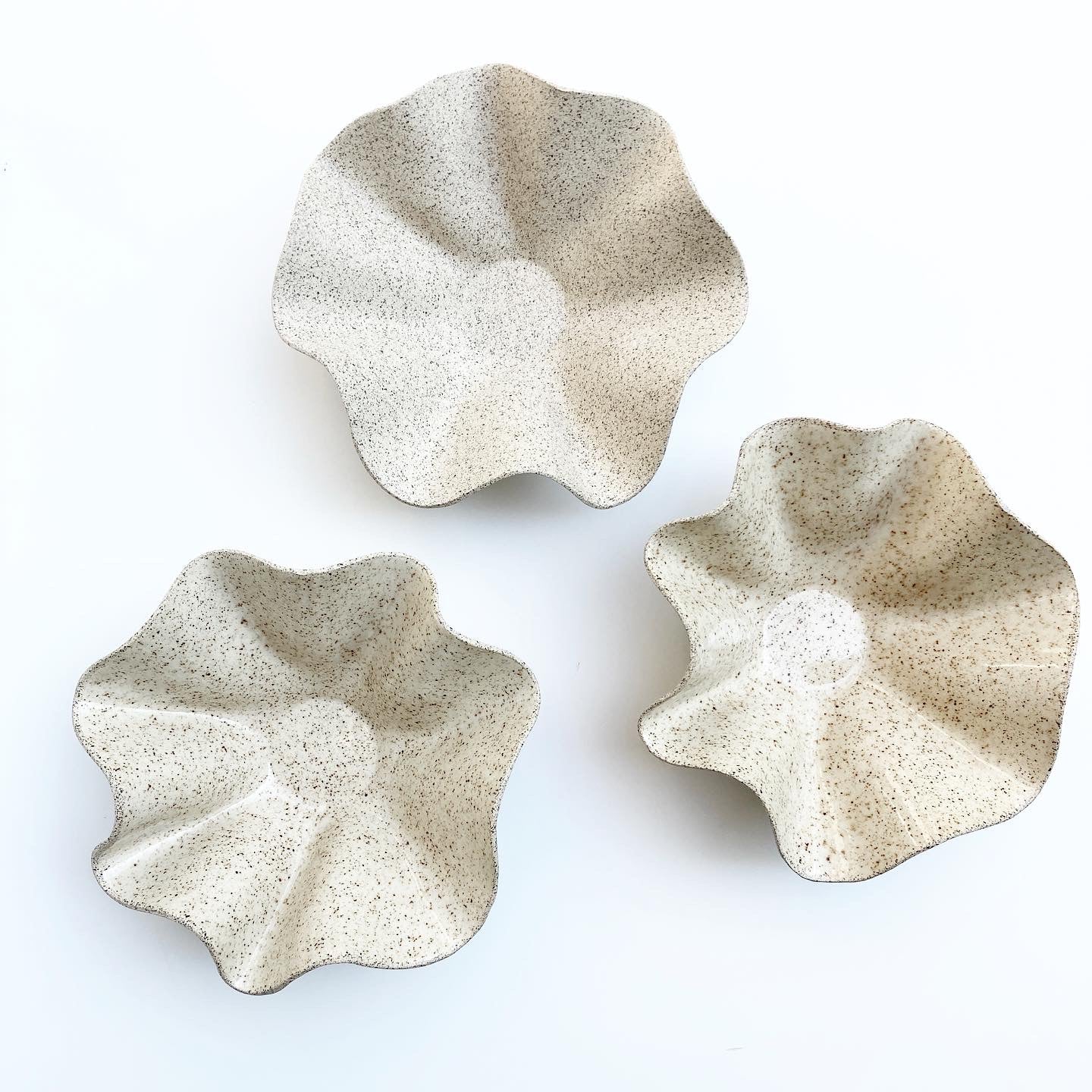 Wavy Handkerchief Bowl, a piece that combines functionality with artistic flair. Handcrafted with care and attention to detail, this bowl is perfect for adding a touch of unique style to your home decor. Made from sandy speckled ceramic clay, this bowl features a wavy design that mimics the folds of a handkerchief.

Freely hand painted.Handmade by Alicja in her Vermont studio.