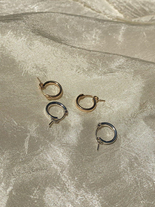 Click hoop earrings might be basic, but never boring. Just the right size to put them in and forget about them but still manage to look put together, a total win! Sterling silver or gold fill, featuring hollow tubes with click-close mechanism. Designed and handmade in Los Angeles.