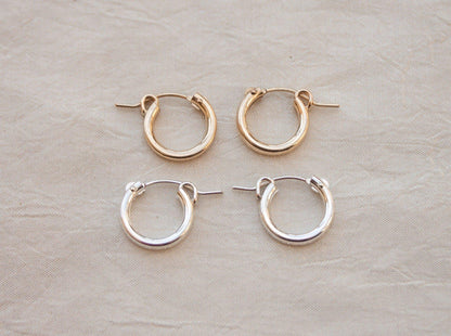 Click hoop earrings might be basic, but never boring. Just the right size to put them in and forget about them but still manage to look put together, a total win! Sterling silver or gold fill, featuring hollow tubes with click-close mechanism. Designed and handmade in Los Angeles.