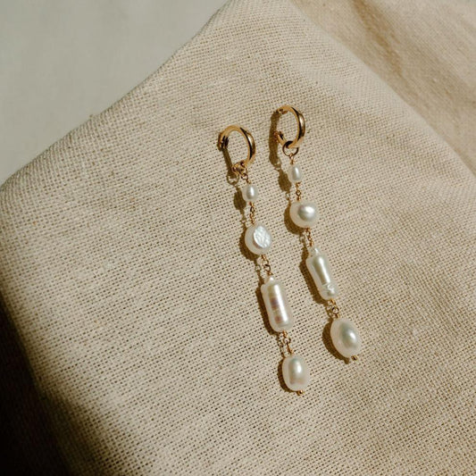 Unique and elegant, these pearl duster earrings were designed with 4 freshwater pearls in various shapes and sizes interconnected with delicate gold fill wire. All Dea Dia pieces are proudly designed and handmade in Downtown Los Angeles.