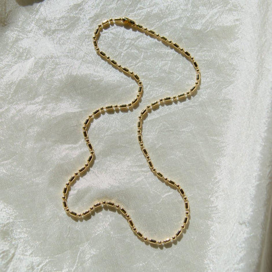 Unique, deadstock vintage ball chain necklace made current with a fresh plating of 14k gold. A perfect 90s vibe chain; use it to layer or add your favorite pendant. This 90's ball chain necklace comes with a long and short pattern.  Designed and handmade in Los Angeles.