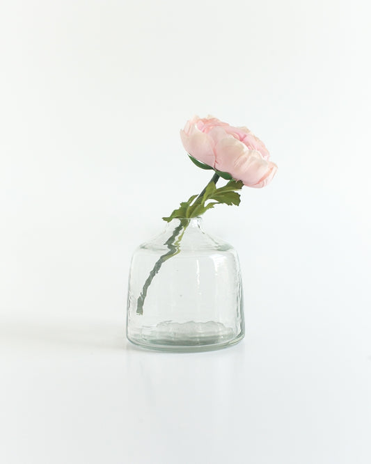 bella hammered glass bud vase . Ideal for showcasing a single bloom or a small bouquet, these bud vases bring a touch of subtle texture to any space while honoring a commitment to people and the planet.