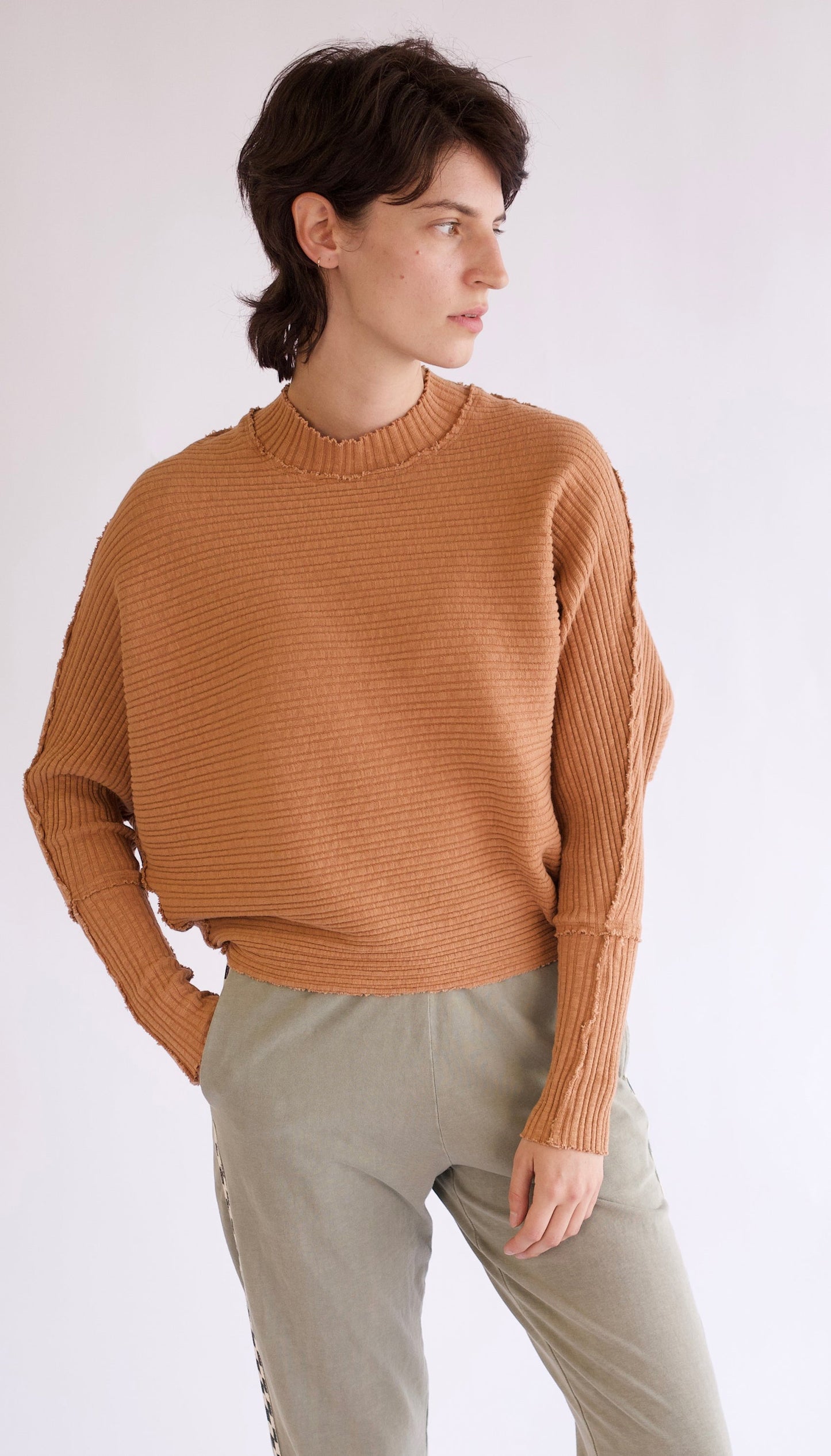 Vintage inspired chunky rib in natural donning elevated raw stitch details. Made with 100% organic cotton.