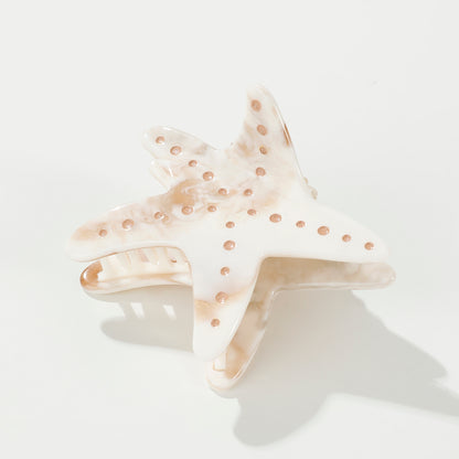 These starfish claw clips feature hand-painted details with a warm, earthy marbled texture. Made with eco-friendly material that is both durable and comfortable.