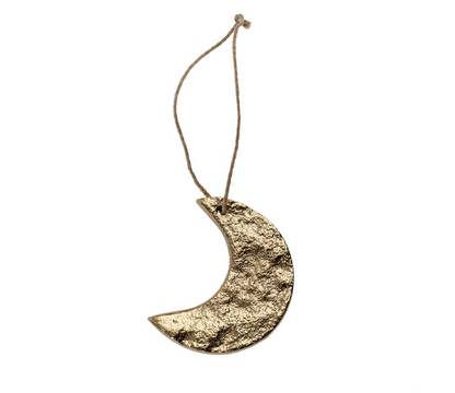 Gold crescent moon ornament on a white background