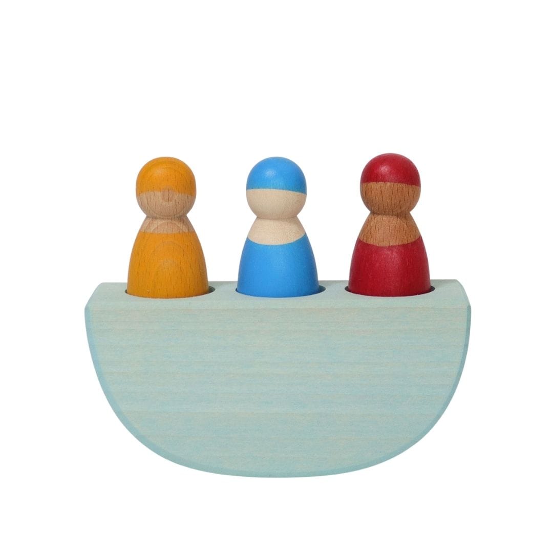 Wooden toy boat with three peg dolls by Grimms.