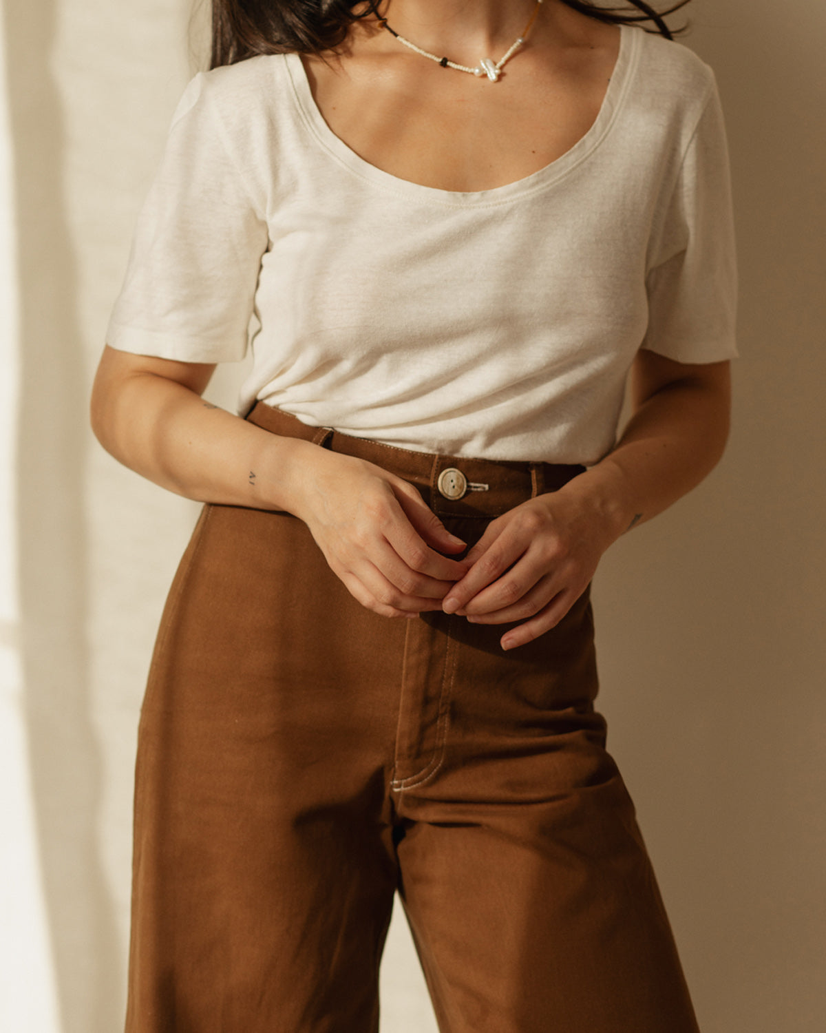 For the ultimate cool girl vibe! Based on Harly Jae's bestselling, form-fitting Pierrot Pants, this new style features a higher waist, unique back pockets, and cool contrast stitching - for a true ode to the 70s era. Handmade with organic cotton blend in Vancouver, BC.