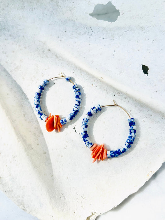 Sodalite and coral shell bunch hoop strung on gold fill hoops. Designed in California by Carrie Marill and made by hand in her SoCal studio.