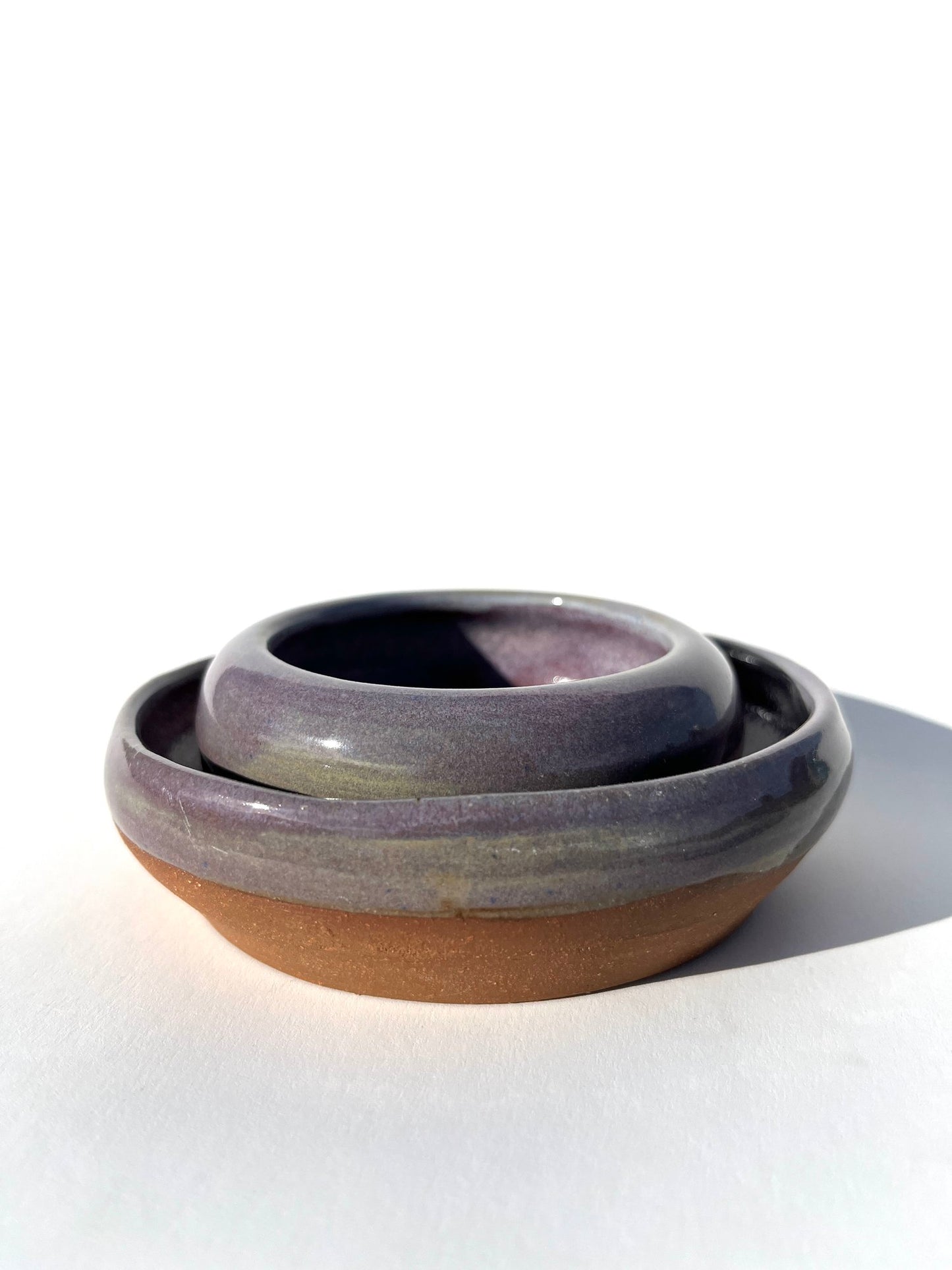 Hand thrown and hand dipped glazed ceramic nesting bowls by Ninth House Goods. A pair of nesting bowls that would be perfect for oil dipping, salsa, or your special jewels and artifacts.
