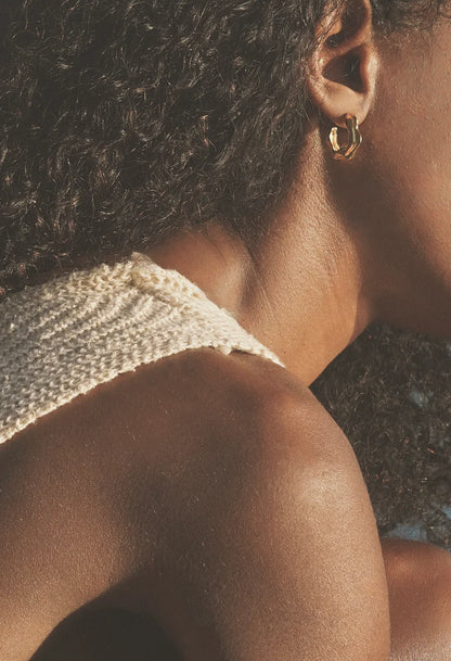 Richly textured hoops. Modern antiquity. Carved minimal light weight mid-size hoop stud earrings. A unique & organic take on a classic style. Handmade in the Santa Cruz Mountains.