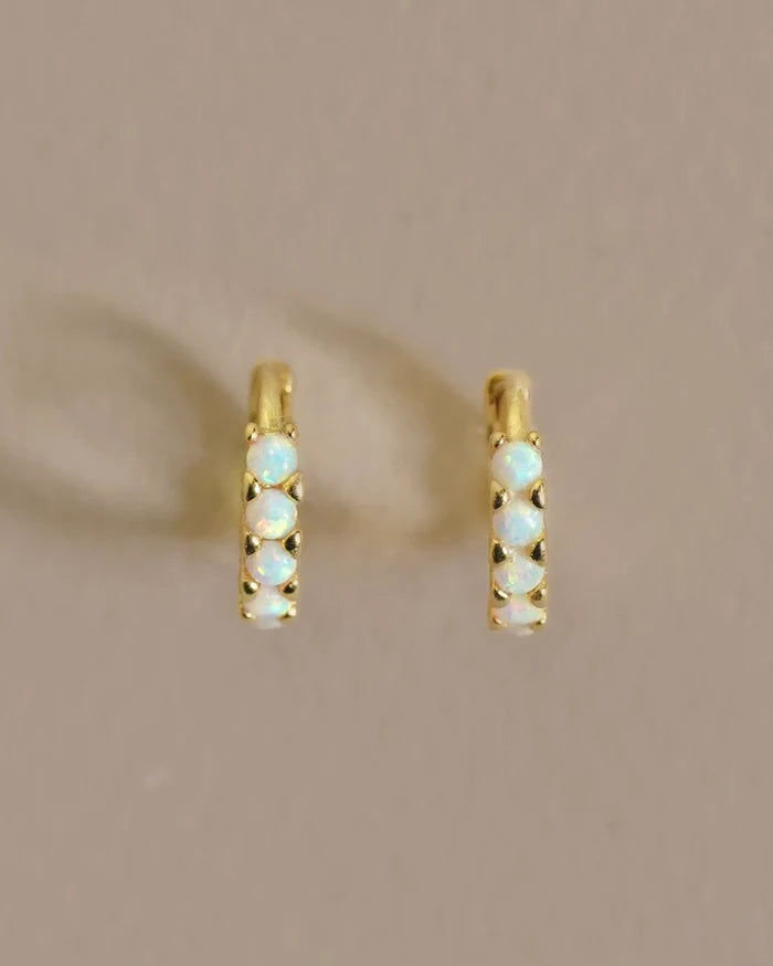 A versatile hoop with colorful Opal stones. This eye-catching everyday earring is a perfect, subtle, understated adornment for any day or occasion. Handmade in the Santa Cruz Mountains.