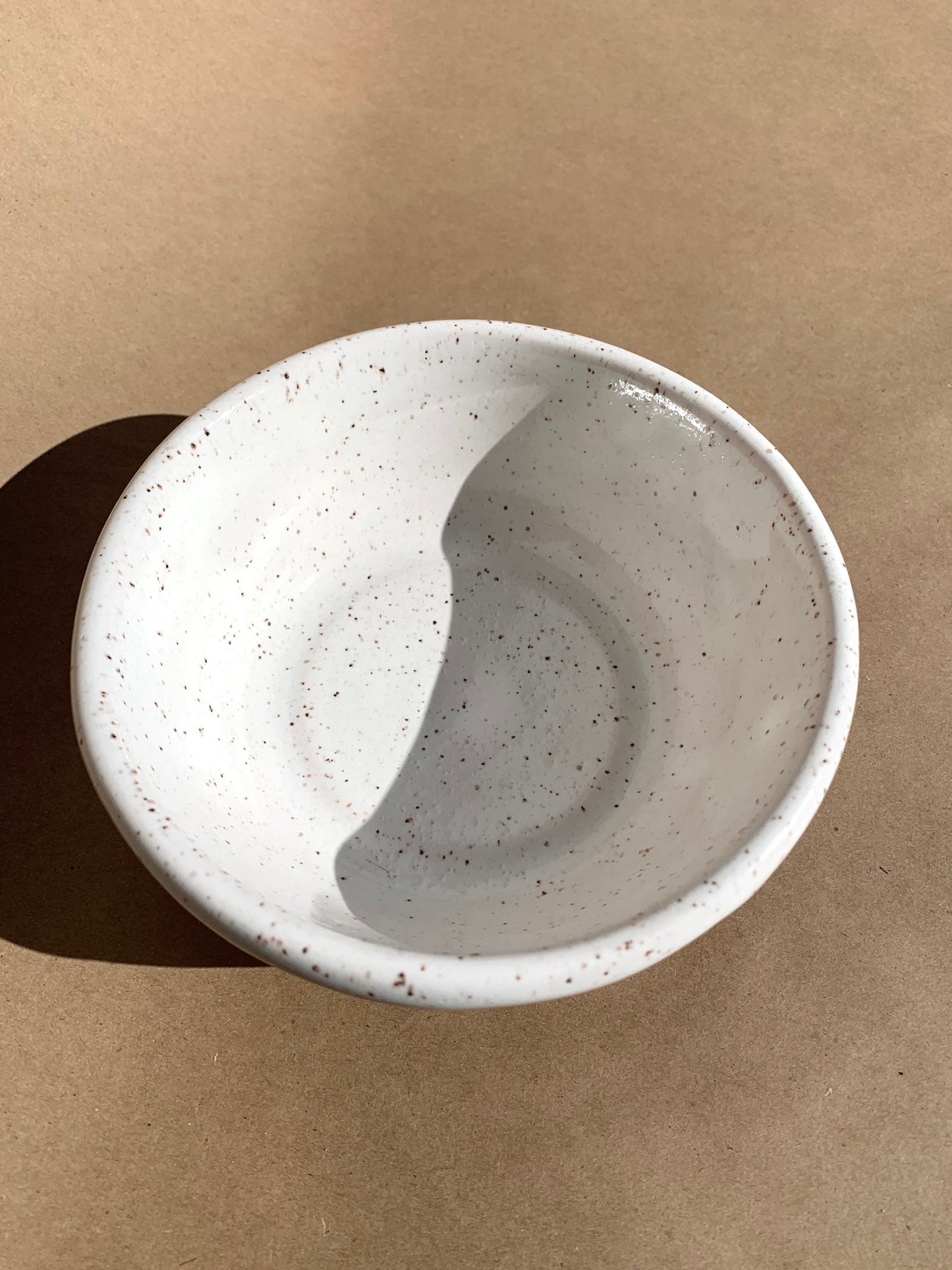 Beautiful smooth bowl great for soup and pasta or simply use it as a catchall. Hand thrown speckled clay with a white gloss glaze.