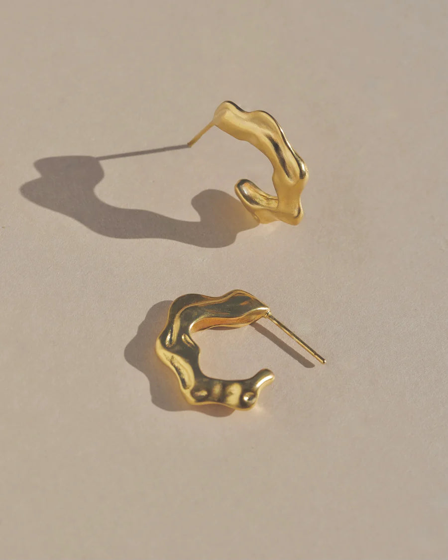Richly textured hoops. Modern antiquity. Carved minimal light weight mid-size hoop stud earrings. A unique & organic take on a classic style. Handmade in the Santa Cruz Mountains.