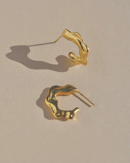 Richly textured hoops. Modern antiquity. Carved minimal light weight mid-size hoop stud earrings. A unique & organic take on a classic style. Handmade in the Santa Cruz Mountains.