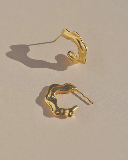 Richly textured hoops. Modern antiquity. Carved minimal light weight mid-size hoop stud earrings. A unique & organic take on a classic style. Handmade in the Santa Cruz Mountains.