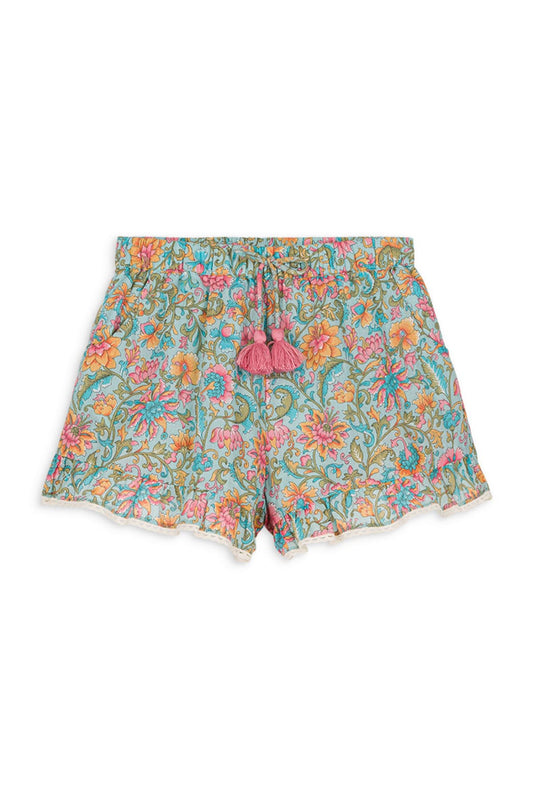 Floral print shorts with an elasticized waist, featuring a decorative bow with handmade pompoms and lace edges at the bottom. Made with 100% organic cotton. Louise misha valloid shorts in water river flowers.