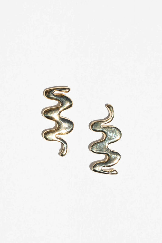 Pair of spiral-shaped earrings on a white background. Moneh Brisel Kombu Earrings 