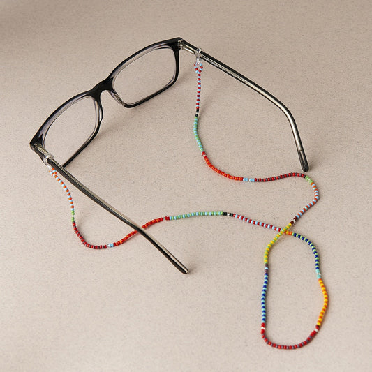 Mother Sierra's Pansy beaded glasses chain, a delightful burst of colors that add a touch of playful charm to any frame. Handmade in Guatemala with Preciosa Ornela Beads.