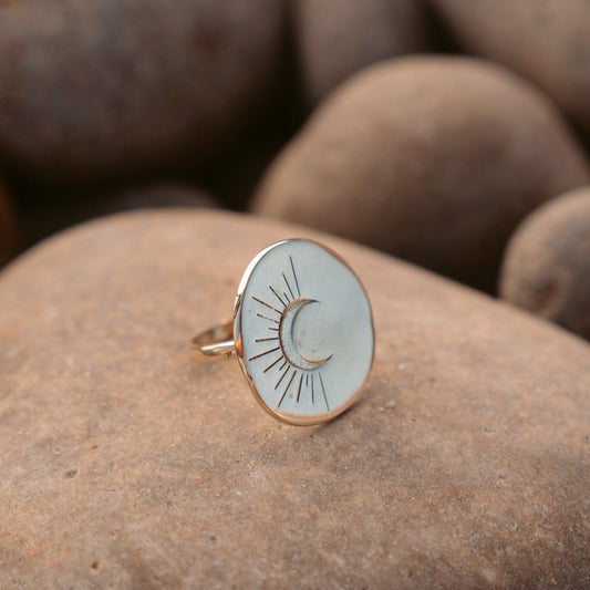 Created from an original hand carved wax and then cast into metal by artisans in Los Angeles, this statement piece has timeless elegance.  Beautifully engraved with a crescent moon, symbolizing regeneration and rebirth. Made from recycled brass or sterling silver - designed and handmade in Downtown Los Angeles.