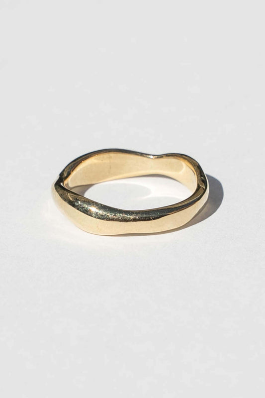 An organic shaped band inspired by the ridges and ruffles of nori seaweed.  Hand carved and cast with a high polish mirror finish. Available in solid brass or sterling silver.