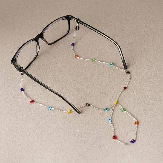 Mother Sierra's Pansy beaded glasses chain, a delightful burst of rainbow colors that add a touch of playful charm to any frame. Handmade in Guatemala with Preciosa Ornela Beads.