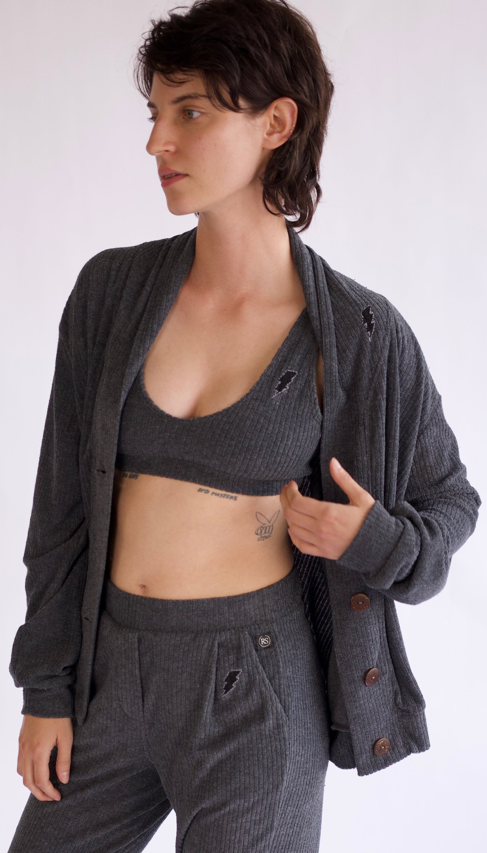 70’s inspired terry drop needle rib cardigan, charcoal dyed in small batches of 4 pieces at a time, each piece is unique. Chic yet uber comfy!