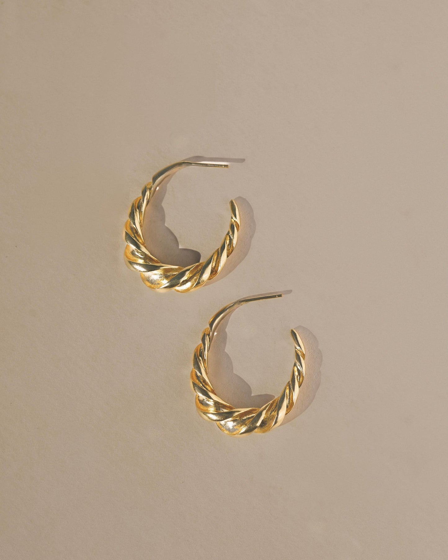 Textured twisted light weight gold vermeil hoop earrings. This pair can be worn daily for a sculptural and elegant classic style, with a twist. Handmade in the Sant Cruz Mountains.