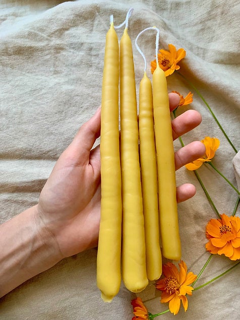 Hand dipped layer by layer and twisted with care, 100% beeswax taper candles. Hand dipped taper candles burn longer, with greater integrity and less drip than tapers formed by pouring into molds.