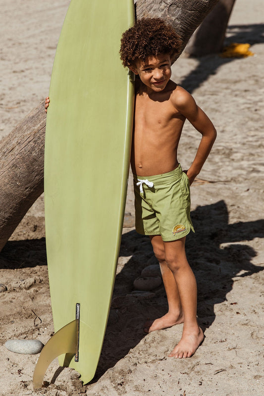 Seaesta Surf kids boardshorts are earth and performance conscious, featuring eco-friendly fabrics and signature vintage-inspired boardshort design. These are pastel earth tone solid boardshorts with a custom Surfy Birdy rainbow wave patch, designed just for Seaesta Surf. 
