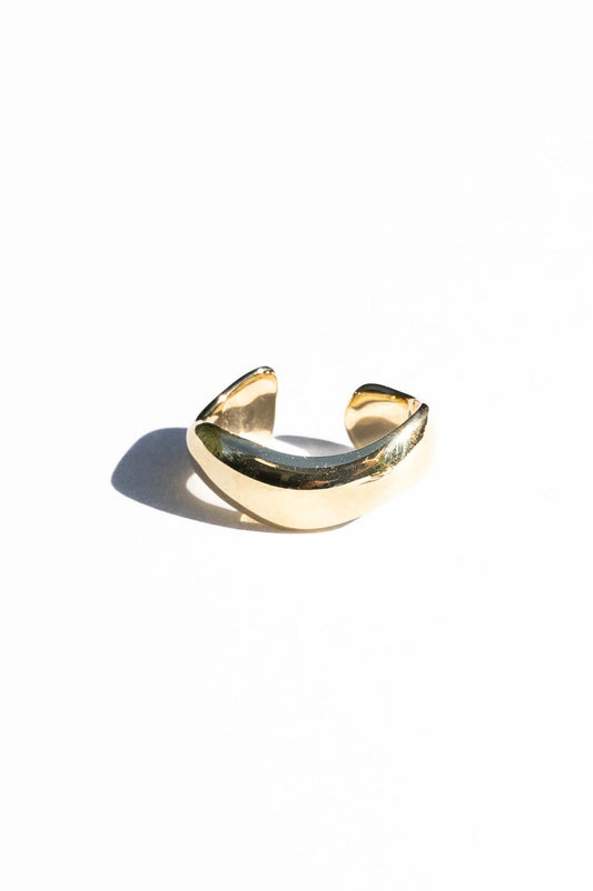 This ear cuff is inspired by the organic ridges and and ruffle of nori seaweed. Perfect for a layered earring look without needing an extra piercing!  Hand carved and cast with a high polished mirror finish. Available in solid brass or sterling silver.&nbsp;