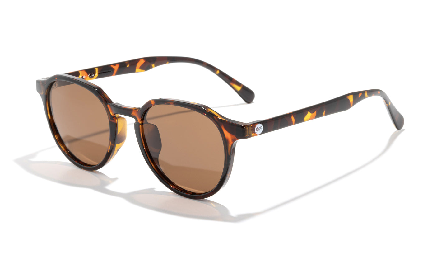 Eco-friendly polarized sunglasses made from recycled plastic. The Vallarta is a unique style with smaller faces in mind. These stylish shades offer a modern twist on a classic design, with a subtle geometric top that adds a touch of edge and sophistication.