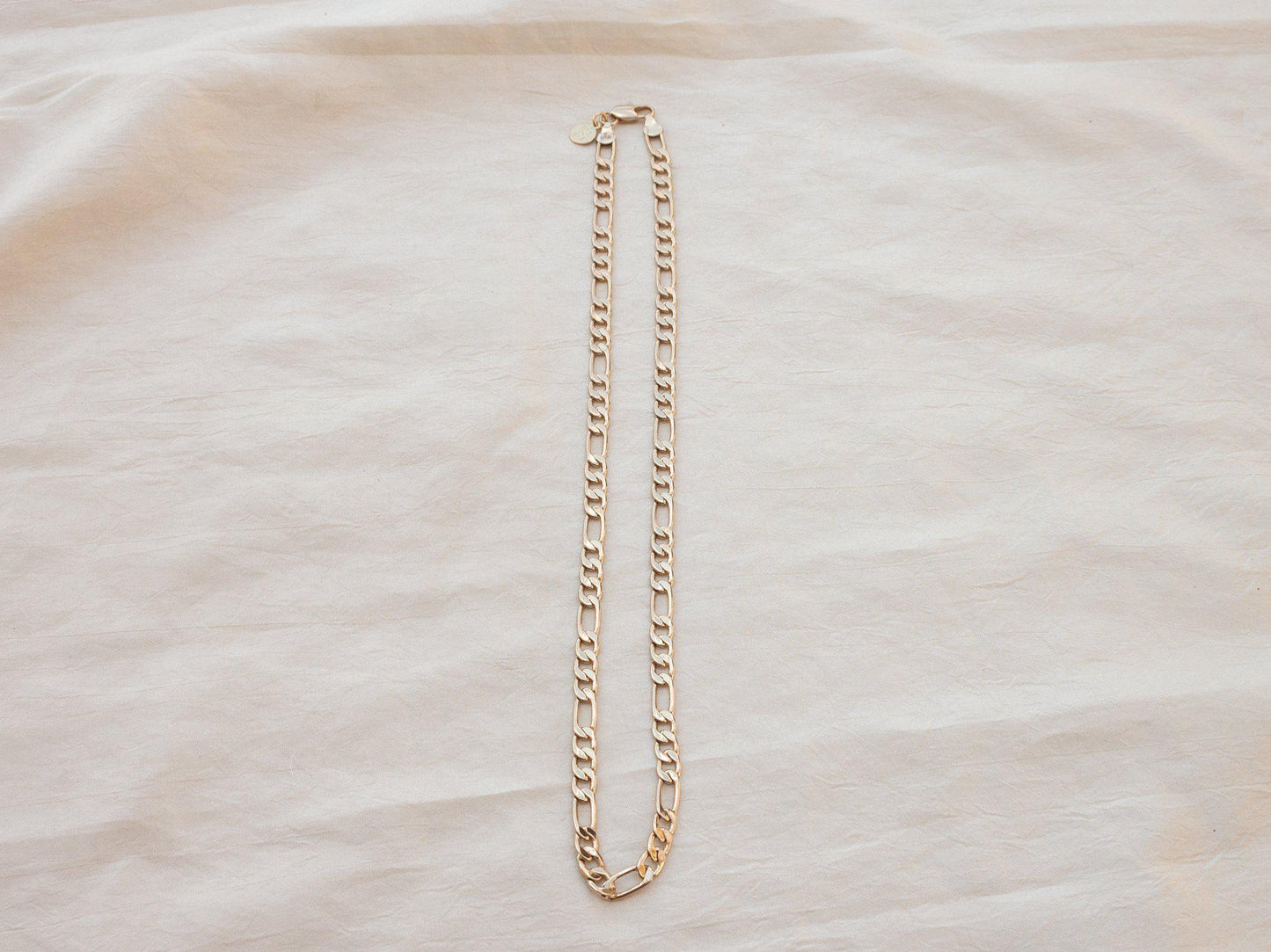 A luxurious thick and bold Figaro chain that looks great solo or layered. 20" long, gold fill. Designed and handmade in Downtown Los Angeles.