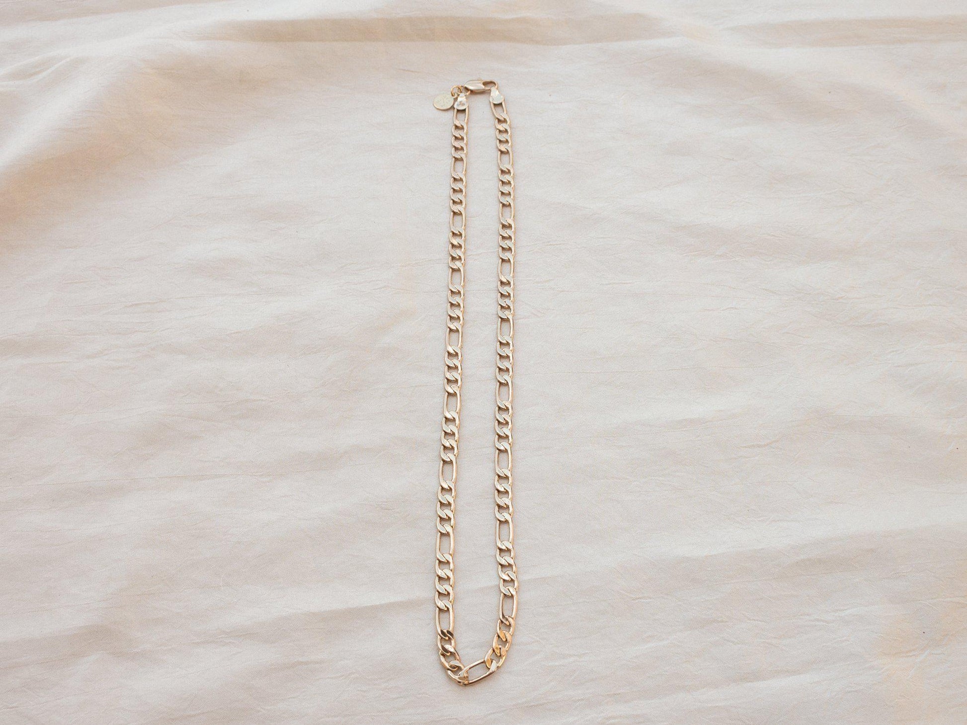A luxurious thick and bold Figaro chain that looks great solo or layered. 20" long, gold fill. Designed and handmade in Downtown Los Angeles.
