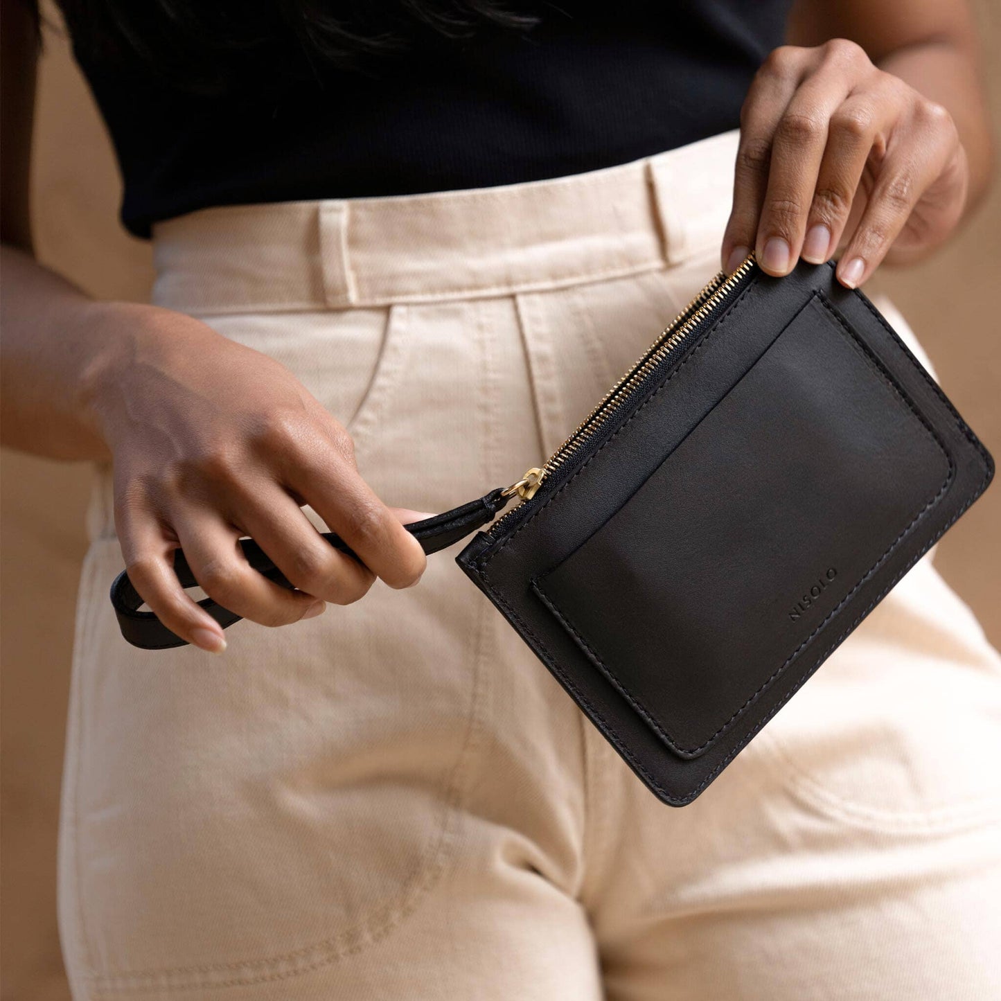 Nisolo Go To Wristlet Clutch -Large enough for your phone, keys, cards, and lip-gloss, yet compact enough to keep things simple, she’s the perfect, minimalistic companion. Crafted from high-quality, full-grain, water-resistant leather, and features wrist strap, Internal card holders and secure, zip-top closure. 100% Living Wages, 0% Net Carbon.