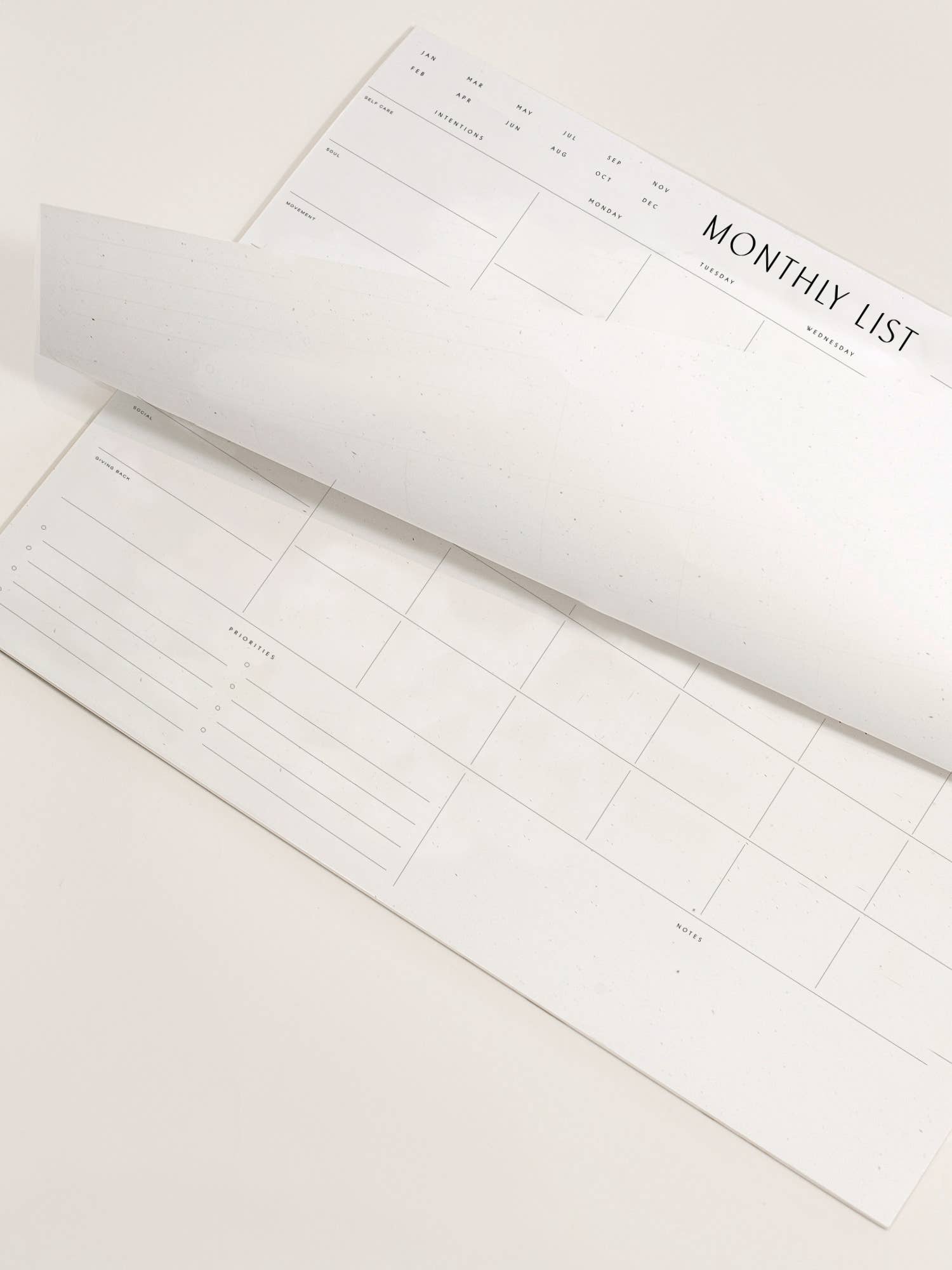 A minimal pad from Wilde House Paper; Introducing the new & improved minimal desk accessory to organize your month & be your best self. Made with recycled paper.