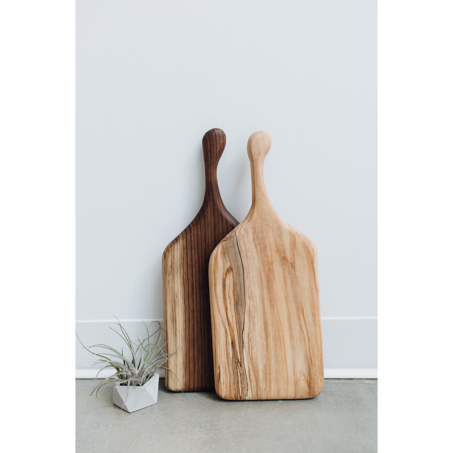 Hand-crafted cheeseboard perfect for a display of cheese or appetizers. The handle is perfect for carrying to the table, and adds visual interest. Made sustainably from maple wood in Gatineau, Canada.