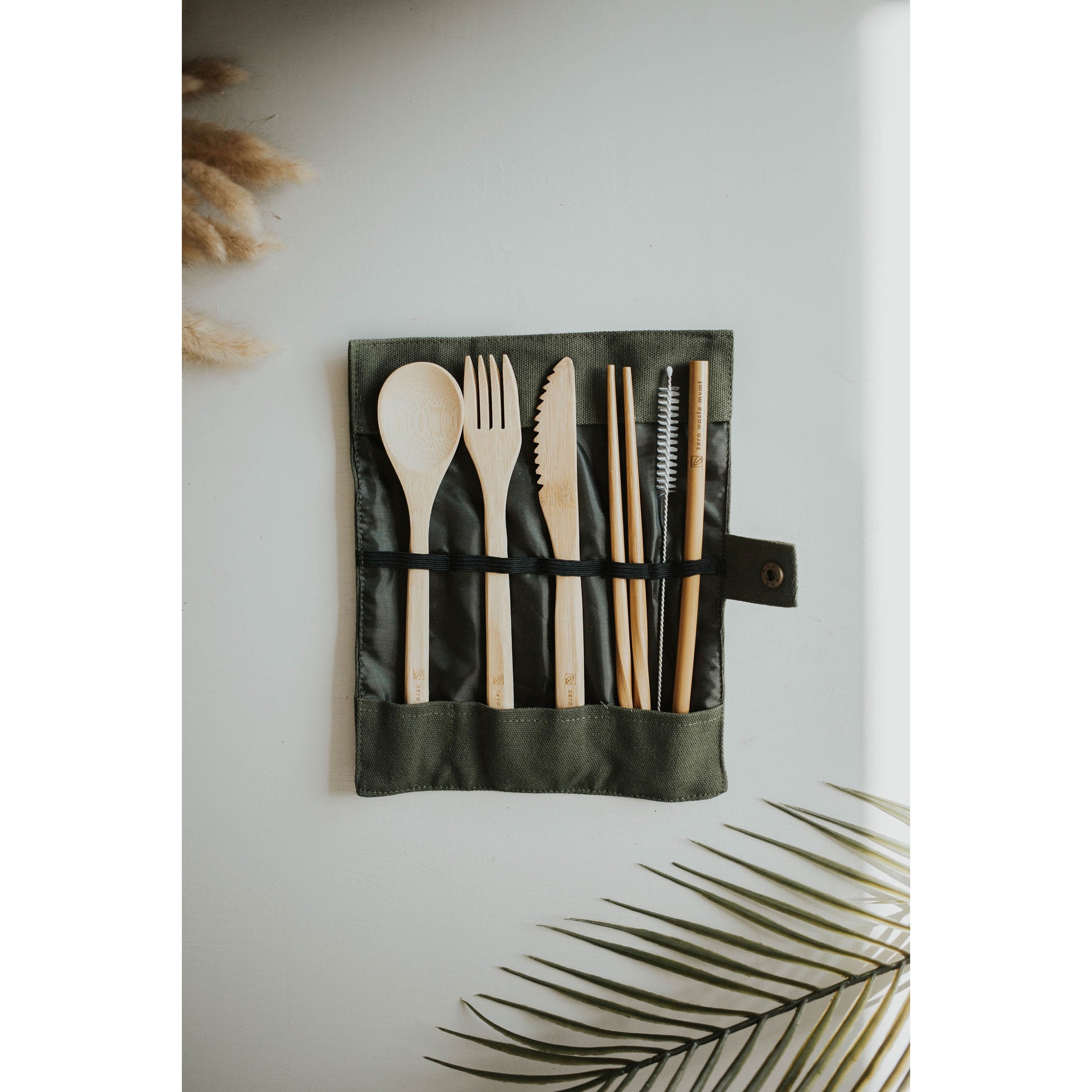 Zero Waste Mvmt Travel Bamboo Utensil Set sold at Thread Spun. All-natural, eco-friendly, biodegradable bamboo cutlery set including fork, spoon, knife, chopsticks and a straw + cleaner brush. It is the perfect size to keep in your car, purse, backpack, or lunchbox! 