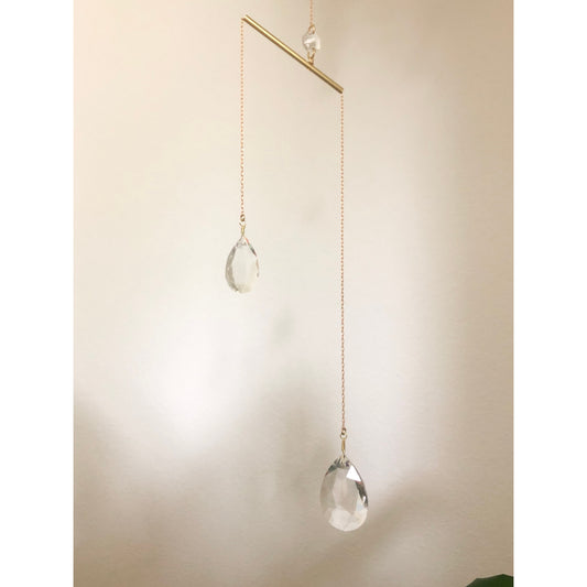 Artisan-crafted sun catcher made from brass wire/chain/tubing plus 3 vintage faceted crystals. Hang it near a window where sunlight will pour through and watch the little rainbows dance around. 