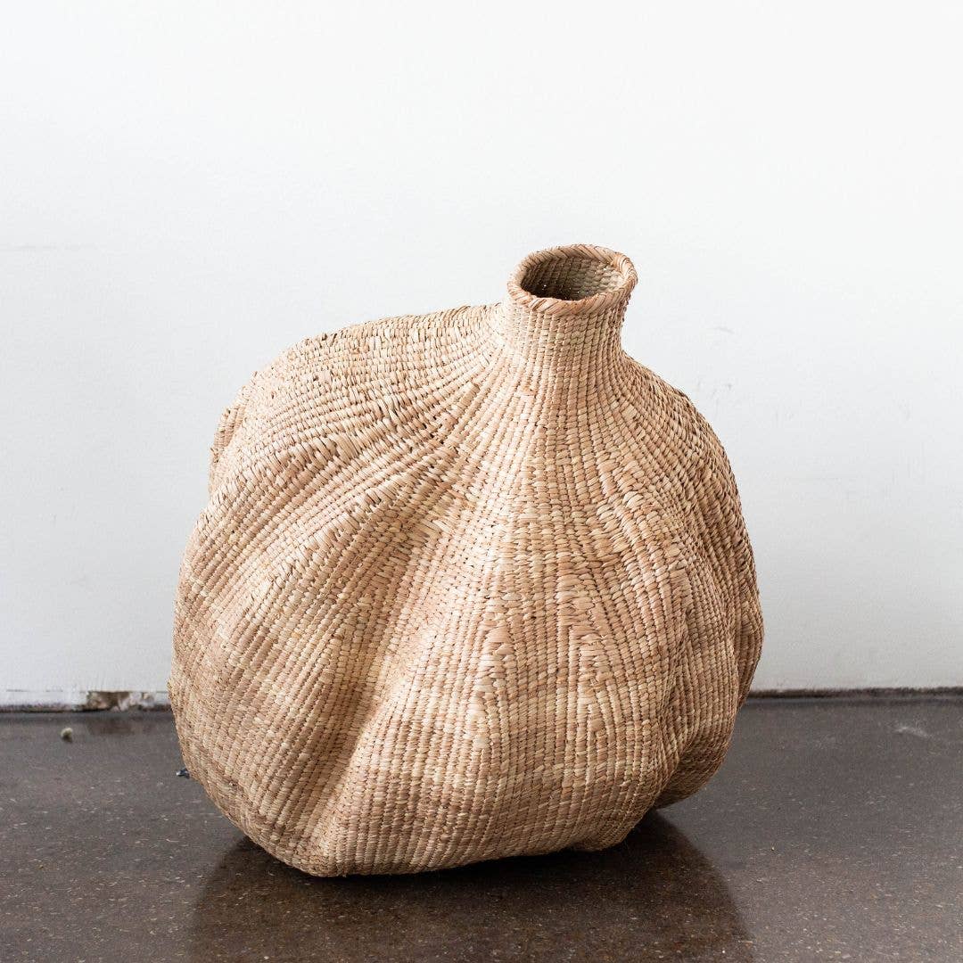 Handmade with the Ilala Palm, these one-of-a-kind baskets are handwoven in Zimbabwe. “Perfectly Imperfect” and organic in shape, no two are the same, and this natural variation draws attention from everyone who sees them. Beautiful when styled alone, or in a grouping, the possibilities are endless.