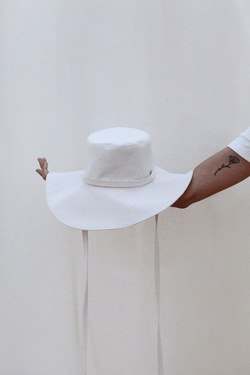 The Sun Hat by PairUp is made for sunny days — this extra wide hat will keep the rays off your cheeks and out of your eyes. Hand sewn in 100% sustainable cotton.