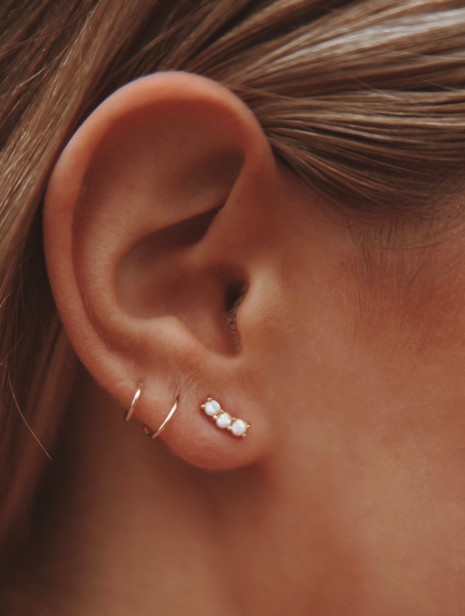 A lovely and vibrant stud earring with prong set opals. Gold vermeil, handmade in the Santa Cruz mountains.